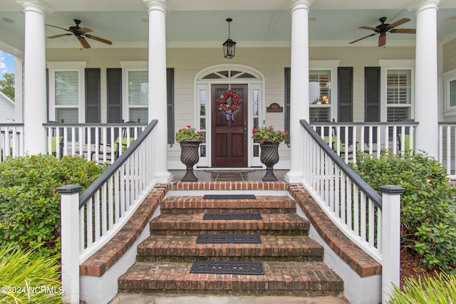 property entrance featuring ceiling fan and a porch