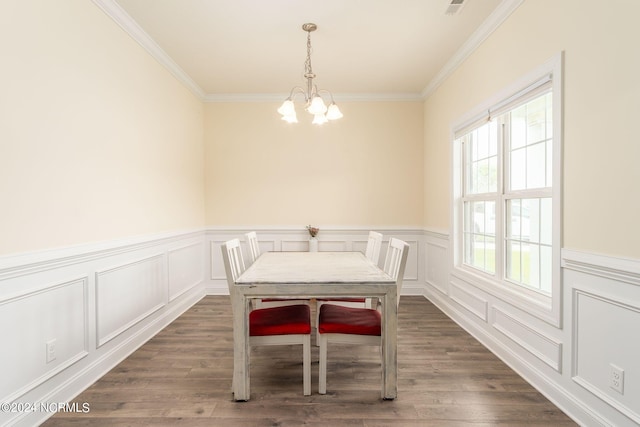 unfurnished dining area featuring ornamental molding, a chandelier, and dark hardwood / wood-style flooring