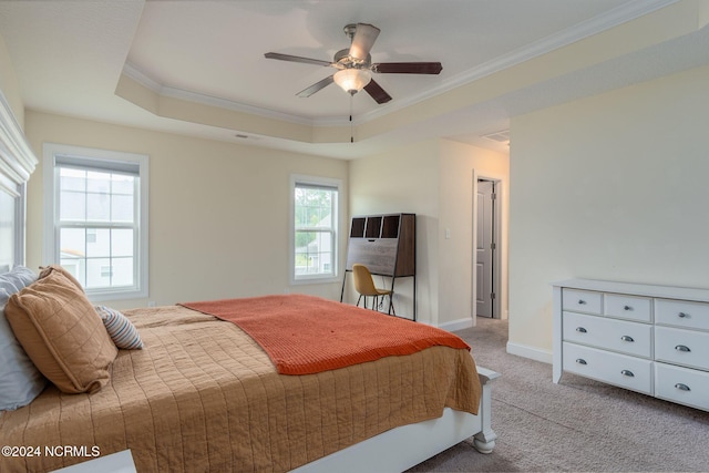 bedroom featuring multiple windows, light colored carpet, ceiling fan, and crown molding