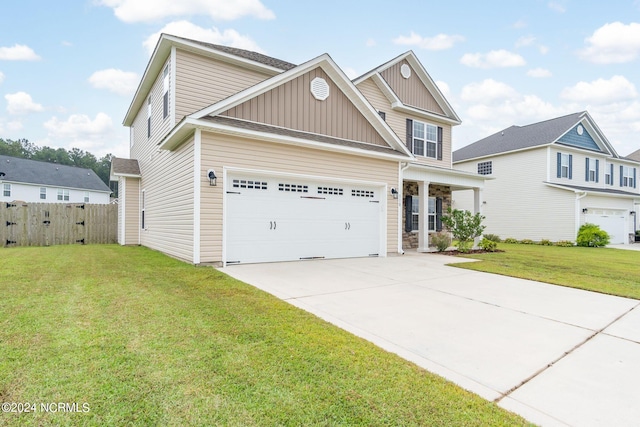 view of front of house with a front yard and a garage