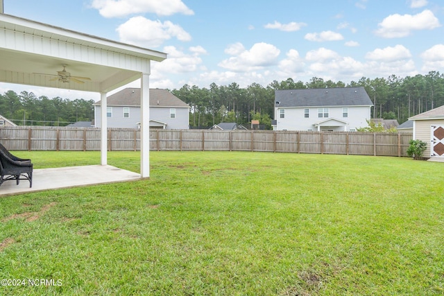 view of yard featuring ceiling fan and a patio area