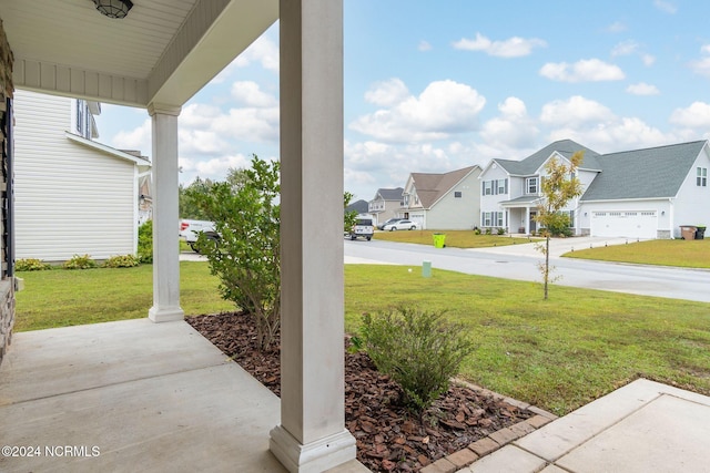 view of yard with covered porch