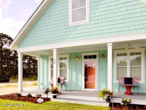 property entrance with covered porch