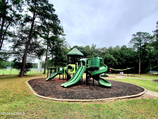 view of playground with a yard