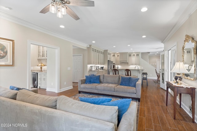 living room with dark hardwood / wood-style flooring, crown molding, beverage cooler, and ceiling fan