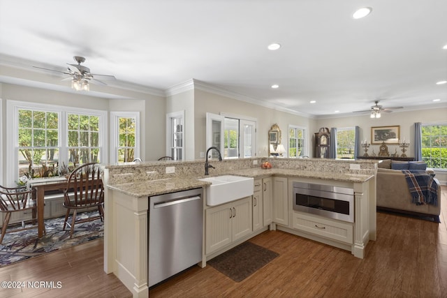 kitchen featuring stainless steel dishwasher, built in microwave, a sink, and a ceiling fan