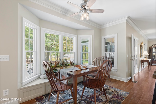 dining room featuring ornamental molding, ceiling fan, and dark hardwood / wood-style flooring