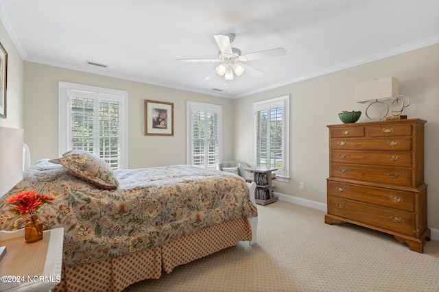 carpeted bedroom featuring multiple windows, crown molding, and ceiling fan