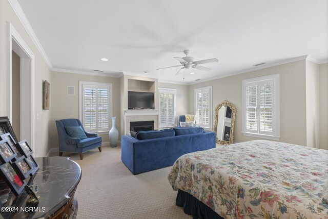 carpeted bedroom with recessed lighting, a fireplace, crown molding, visible vents, and ceiling fan