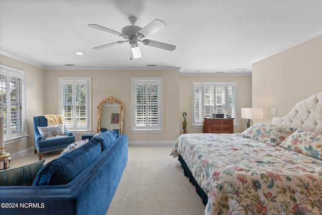 bedroom with ceiling fan, ornamental molding, and light carpet