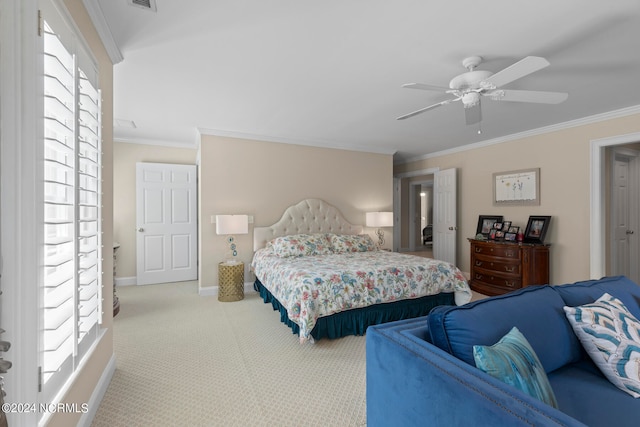 carpeted bedroom with crown molding and ceiling fan