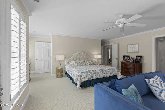 carpeted bedroom with crown molding, ceiling fan, baseboards, and visible vents