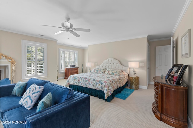 carpeted bedroom with crown molding and ceiling fan