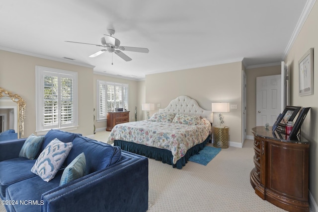 carpeted bedroom with crown molding, ceiling fan, baseboards, and visible vents