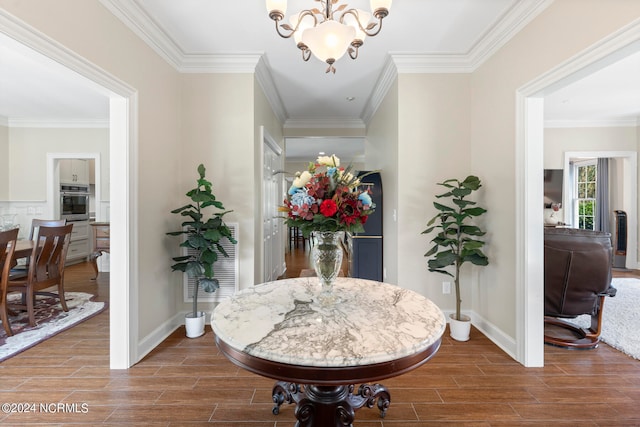 dining space featuring a notable chandelier and ornamental molding