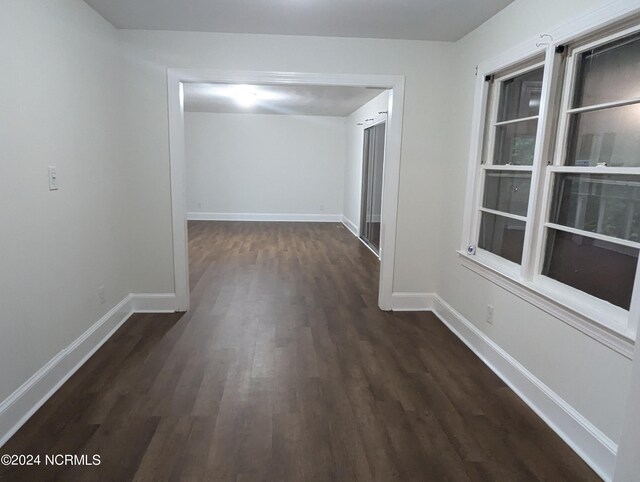 spare room featuring dark hardwood / wood-style floors