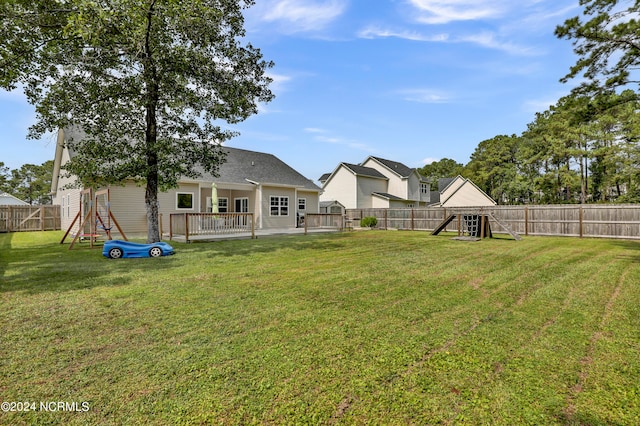 view of yard with a wooden deck