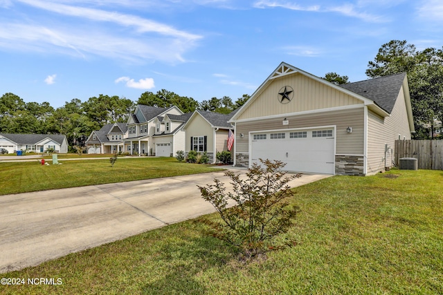 view of front of home featuring a garage and a front yard