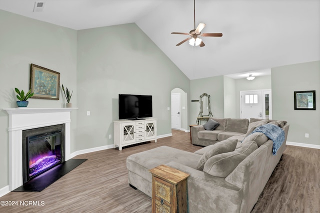 living room with high vaulted ceiling, wood-type flooring, and ceiling fan