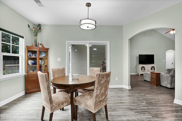 dining space with hardwood / wood-style floors and ceiling fan