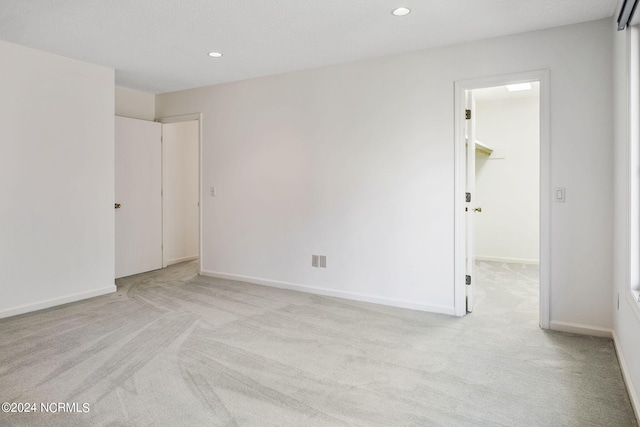 empty room with light colored carpet