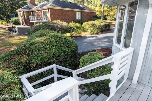 view of side of home featuring central AC unit