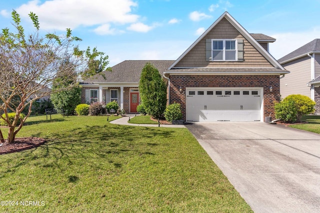 view of front of home with a garage and a front lawn