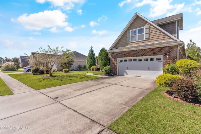 view of front of home featuring a garage and a front lawn