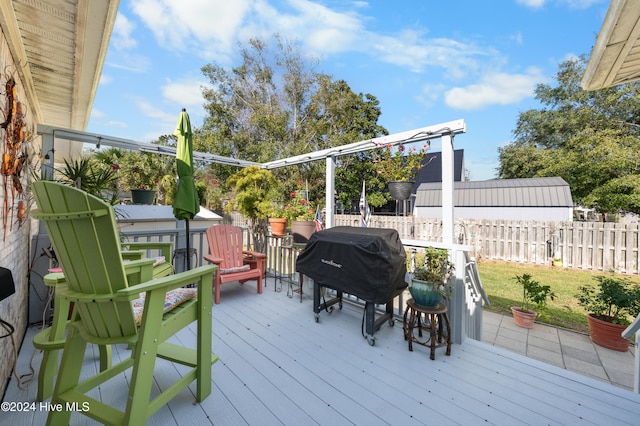 wooden deck featuring area for grilling