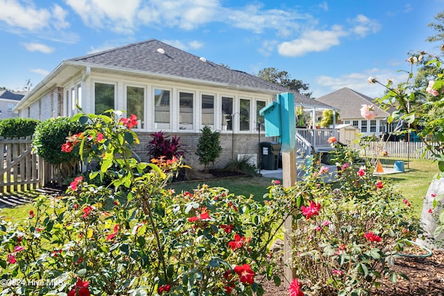 back of house with a yard