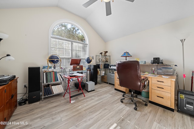 home office with light hardwood / wood-style flooring, ceiling fan, and vaulted ceiling