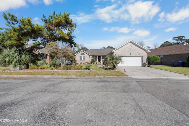 view of front of house featuring a garage and a front yard