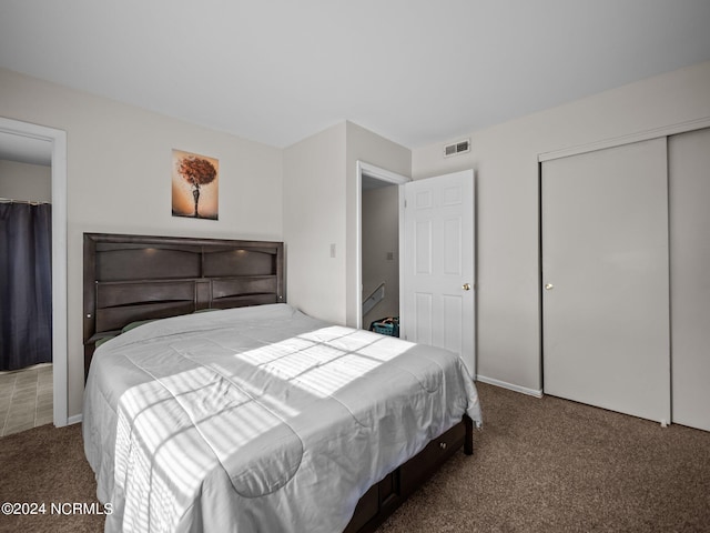 bedroom with carpet floors and a closet