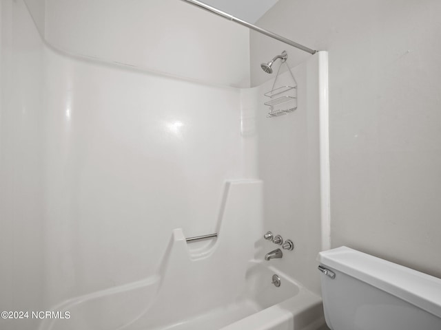 bathroom featuring  shower combination and toilet