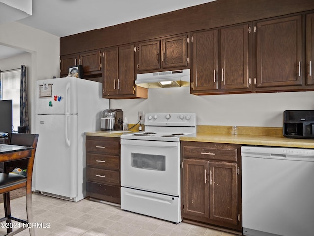 kitchen with dark brown cabinetry and white appliances