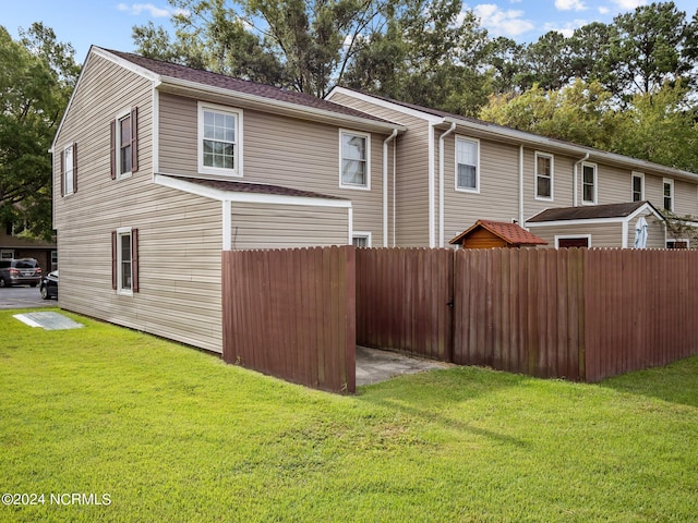 view of property exterior featuring a yard