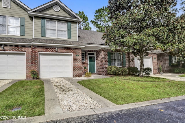 view of front facade featuring a garage and a front yard