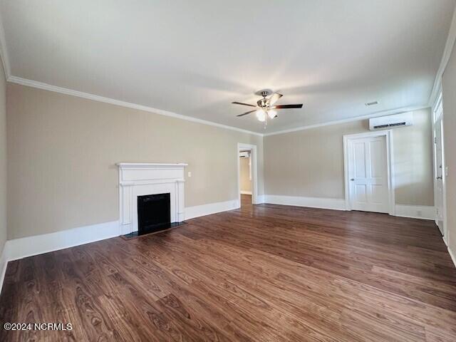 unfurnished living room with ornamental molding, dark hardwood / wood-style flooring, and ceiling fan