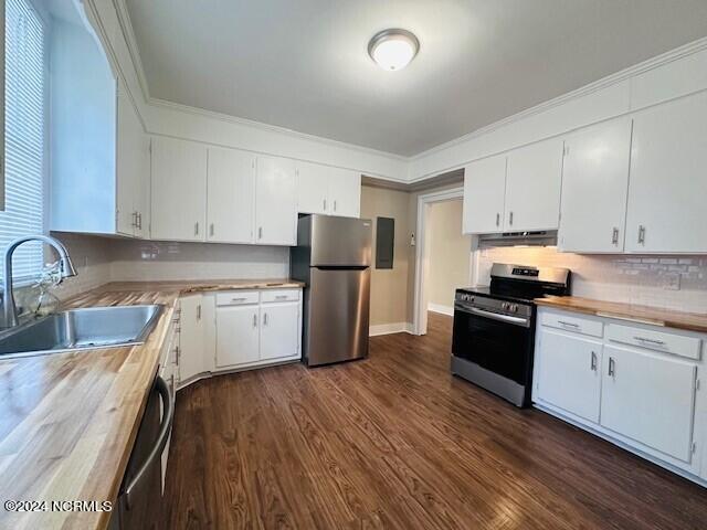 kitchen with stainless steel appliances, sink, and white cabinetry