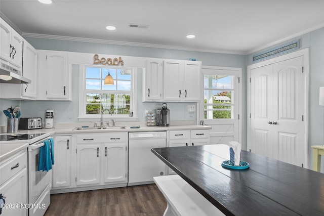 kitchen featuring sink, white appliances, and white cabinetry