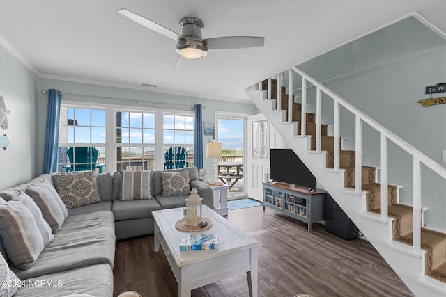 living room with ceiling fan, ornamental molding, plenty of natural light, and dark hardwood / wood-style flooring