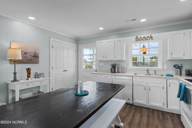 kitchen with white appliances, white cabinets, sink, and a wealth of natural light