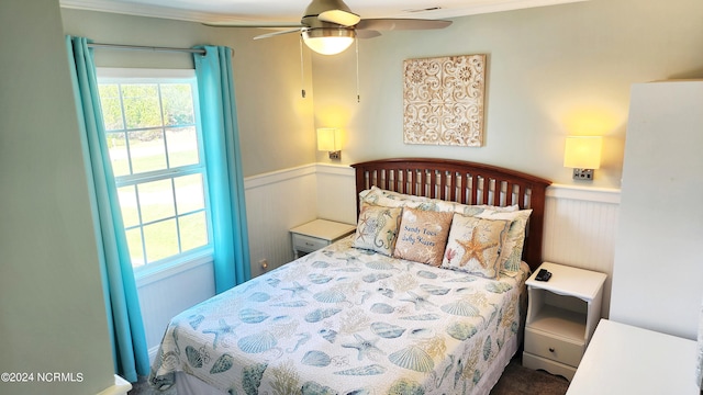 bedroom featuring crown molding, multiple windows, and ceiling fan