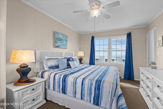 bedroom with dark carpet, crown molding, and ceiling fan