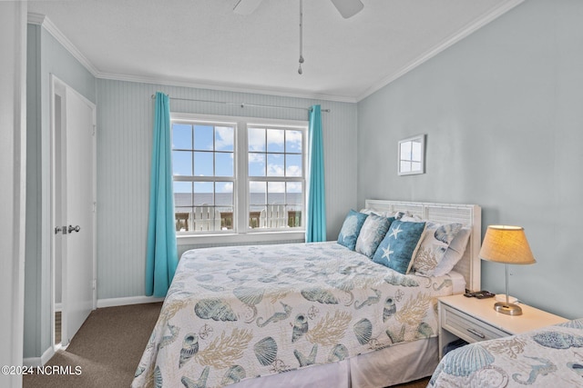 bedroom featuring crown molding, ceiling fan, and carpet flooring