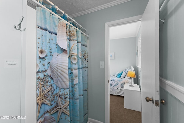 bathroom featuring a textured ceiling and crown molding