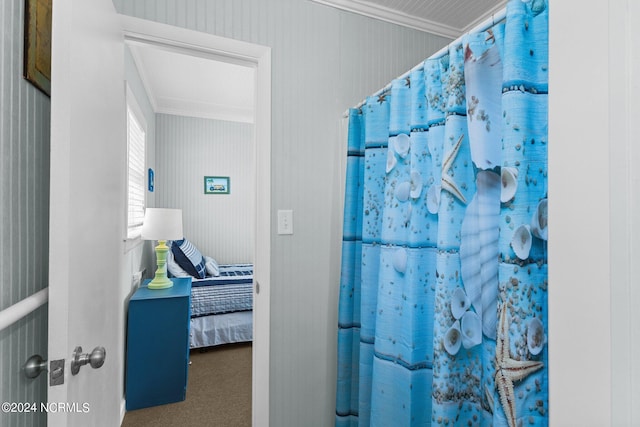 bathroom featuring ornamental molding and a shower with curtain