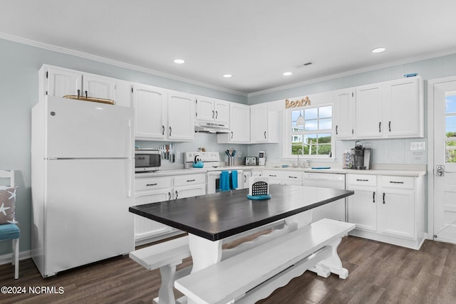 kitchen with white appliances, crown molding, white cabinets, and dark hardwood / wood-style flooring