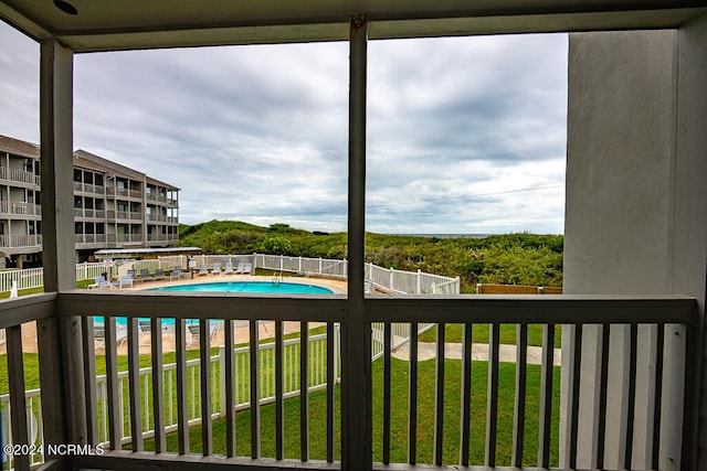 view of pool featuring a yard