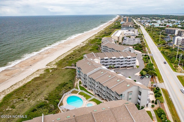 drone / aerial view with a view of the beach and a water view